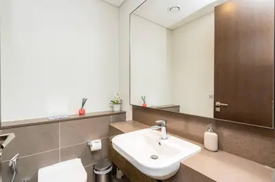 a bathroom with a sink and a mirror at CitiHome - Elegant Retreat in Dubai Marinas Heart in Dubai