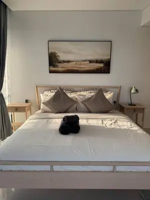 a stuffed animal sitting on top of a bed at 3 bedroom 51st floor Panoramic ocean views in Dubai