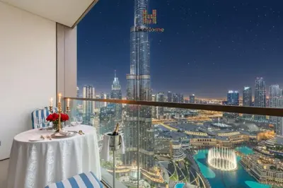 a room with a table and a view of a city at Best Burj khalifa View 2 Mins Dubai Mall Like home in Dubai