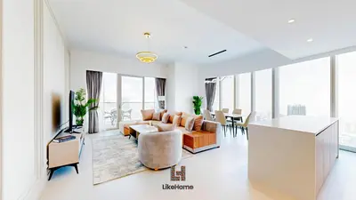a living room with a couch and a table at Direct Burj Khalifa views Lux Sky Manson Like Home in Dubai