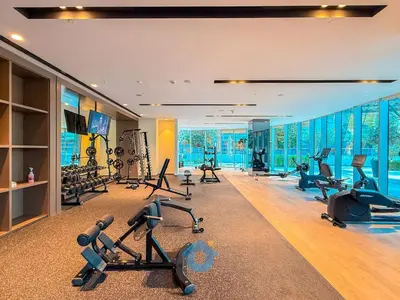 a gym with treadmills and exercise equipment in a room at Next to Burj Khalifa - Skyline Balcony Like home in Dubai