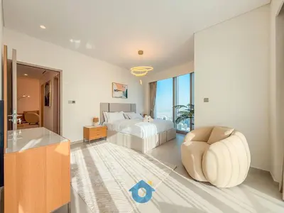 a bedroom with a bed and a chair and a tub at NEXT TO DUBAI MALL AND BURJ 2BR in Dubai