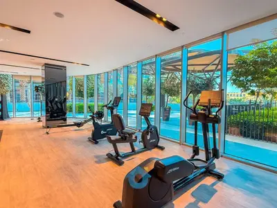 a gym with treadmills and exercise equipment in a building at NEXT TO DUBAI MALL AND BURJ 2BR in Dubai