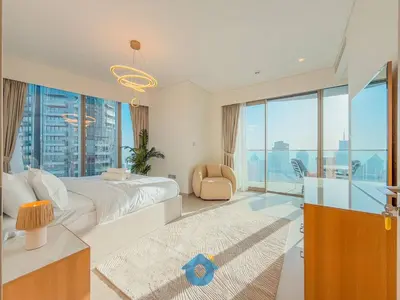 a bedroom with a large bed and a large window at NEXT TO DUBAI MALL AND BURJ 2BR in Dubai