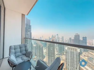a room with two chairs and a view of a city at BEST SEA VIEW NEXT TO BURJ KHALIFA AND DUBAI MALL in Dubai