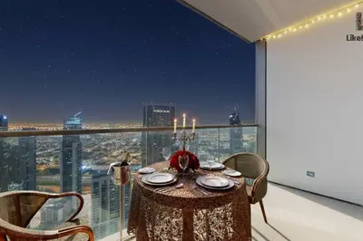 a table in a room with a view of a city at 5 MINUTES BY WALK FROM BURJ ADN DUBAI MALL in Dubai