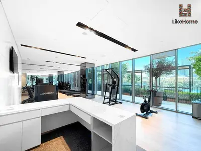 an office with a large white desk and large windows at NEXT TO BURJ KHALIFA AND DUBAI MALL in Dubai