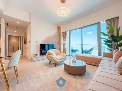 a living room with a couch and chairs and a tv at Direct Burj Khalifa View Near Dubai Mall Like Home in Dubai