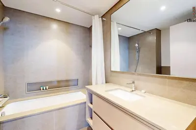 a bathroom with a sink and a mirror at DIRECT BURJ KHALIFA ONLY 2 MINUTES AWAY in Dubai