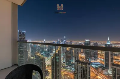 a room with a view of a city at night at DIRECT BURJ KHALIFA ONLY 2 MINUTES AWAY in Dubai