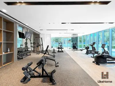 a gym with treadmills and exercise equipment in a building at NEXT TO BURJ KHALIFA AND DUBAI MALL ONLY 2 MINUTES AWAY in Dubai