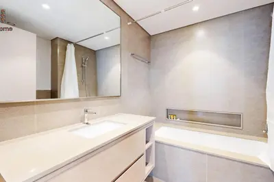 a bathroom with a sink and a mirror at BEST LOCATION 2 MINUTES AWAY FROM BURJ KHALIFA in Dubai