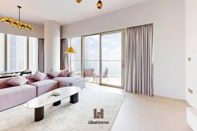 a living room with a couch and a table at Exclusive Burj Khalifa View 3BR SkyManson LikeHome in Dubai