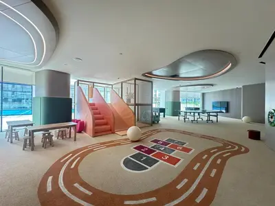 a large room with a race track rug on the floor at Luxury 1BR - Private Balcony Pool & Smart Home - Binghatti Phantom JVC in Dubai
