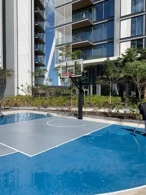 a basketball hoop in front of a building at StayShort - Bluewaters Finest Elegant 1BR Apartment - Beach Lifestyle in Dubai
