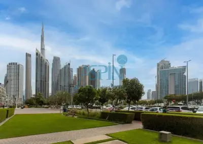 a view of a city with cars parked in a park at Aspin Stylish Burj Views Studio-City View in Dubai