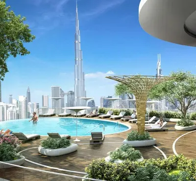 a swimming pool with chairs and a city skyline at Imperial Avenue Downtown Lux 1Bed with Balcony in Dubai