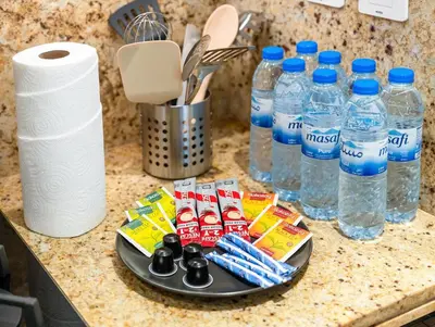 a counter top with bottles of water and toothpaste at Luxurious 3-bedroom apartment downtown in Dubai