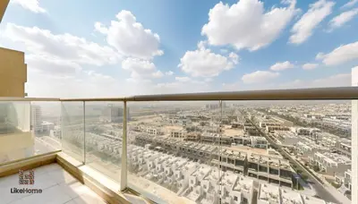 a view of a city from the balcony of a building at Family-Friendly 2BR in Azizi Plaza with Pool & Gym in Dubai