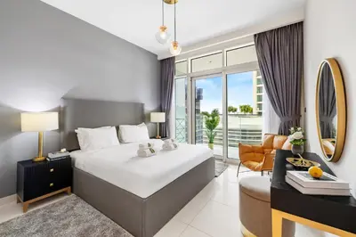 a hotel room with a bed and a large window at BLVD-Beachfront Luxe Stay with Private Beach Access in Dubai