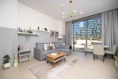 a living room with a couch and a table at Luxury Bluewater Escape 1BR Canal view 5242T in Dubai