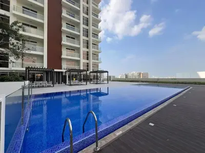 a large swimming pool in front of a building at Luxurious Haven Studio In Jewelz Arjan 03 in Dubai