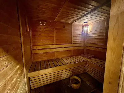 an empty wooden sauna with a toilet in it at Modern 2-Bedrooms Apartment with Stunning Marina Views in Dubai