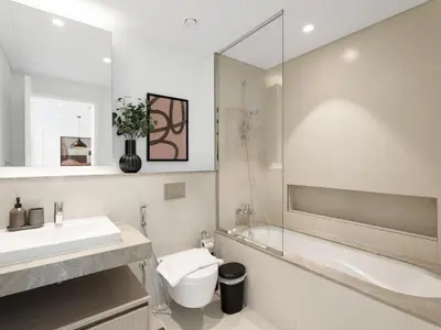 a bathroom with a sink and a toilet and a mirror at The Grand Majestic Sky Luxe 1BR Sleeps 4 06 in Dubai