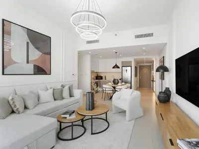 a living room with a white couch and a table at The Grand Majestic Sky Luxe 1BR Sleeps 4 06 in Dubai
