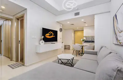 a living room with a couch and a table at Modern Luxury Stylish 2BR Near Downtown Aykon C in Dubai