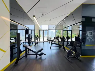 a gym with treadmills and cardio equipment in a building at Modern Luxury Stylish 2BR Near Downtown Aykon C in Dubai
