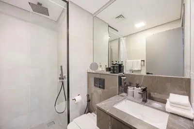 a bathroom with a sink and a mirror at Daniels Studio at V2 Residence, Sports City in Dubai