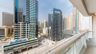 a view of a city skyline from a balcony at Marina View Tower 2BR Stunning Canal Views in Dubai