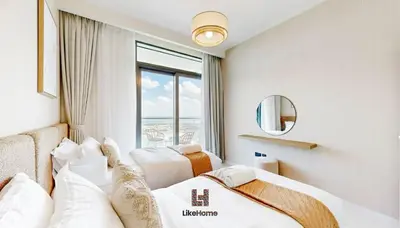a hotel room with two beds and a window at Chic 2BR Getaway Marina Vista T2 Sea view in Dubai