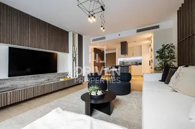 a living room with a large flat screen tv at La Mer Iconic View 1 bedroom in Dubai