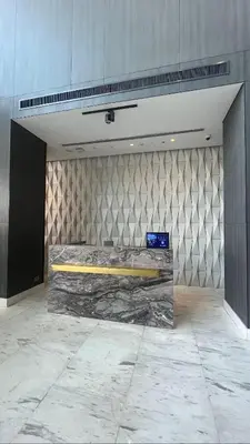 a room with a large bed in a building at Vogue JVT Novotel near Springs Souk Mall, One Bedroom apartment with Balcony and Vibrant Community View, Access to all Amenities in Dubai