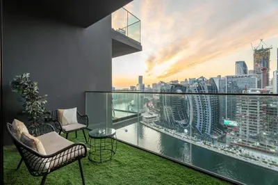 a balcony with a view of a city skyline at GuestReady - Studio l Partial Burj Khalifa View in Dubai