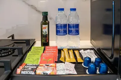 a drawer with two bottles of water and books at Airstay - Stylish Studio - Spacious Balcony - Monthly Offer Available! in Dubai