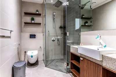 a bathroom with a shower and a sink and a toilet at Cozy 2BR Near Zabeel Park - Dubai frame view in Dubai