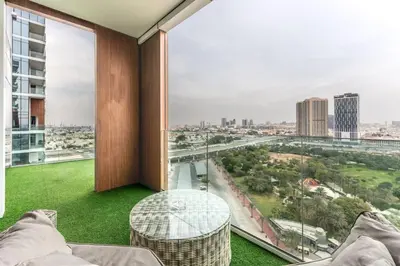 a room with a large window with a view of a city at Cozy 2BR Near Zabeel Park - Dubai frame view in Dubai