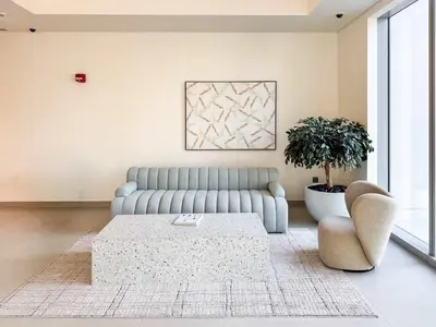 a living room with a couch and a coffee table at PVH - Contemporary 1BR Near Burj Khalifa - Forte Tower 2 in Dubai