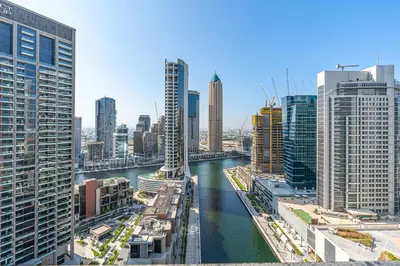a view of a river in a city with tall buildings at Luxury 1Bed with Canal Views Near Burj Khalifa in Dubai
