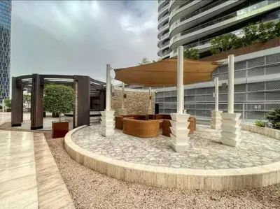 a pavilion in front of a building at High floor downtown apartment opposite Dubai Mall in Dubai