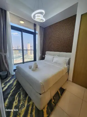 a bedroom with a large bed with a large window at Majestic Canal View 2Bhk 6pax in Dubai