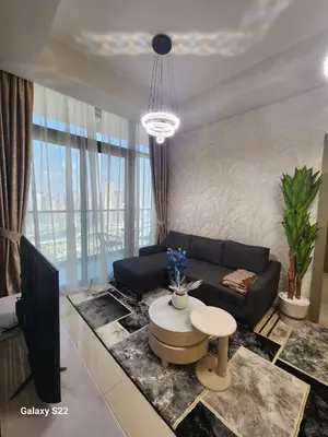 a living room with a couch and a table at Majestic Canal View 2Bhk 6pax in Dubai