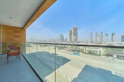 a balcony with a view of a city skyline at Elegant 2BR Getaway in Azizi Riviera Near Downtown in Dubai