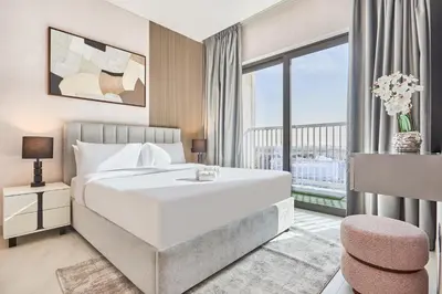 a bedroom with a large bed and a large window at STAY BY LATINEM Luxury 1BR Holiday Home CA 1605 Near Burj Khalifa in Dubai