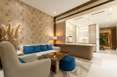 a living room with a couch and chairs and a table at Designer Apartment 34-56 with Private Jacuzzi in JVC in Dubai