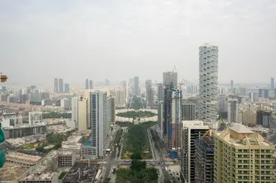 an aerial view of a city with tall buildings at Designer Apartment 34-56 with Private Jacuzzi in JVC in Dubai