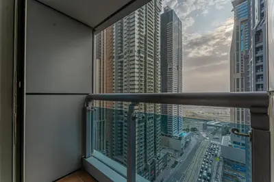a balcony with a view of a city at HAVN - High Floor 2 Bedroom in Marina, near Tram in Dubai